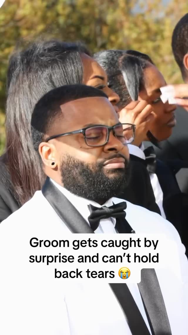 Still from a Nigerian wedding video — groom mid-reaction to his bride's voice